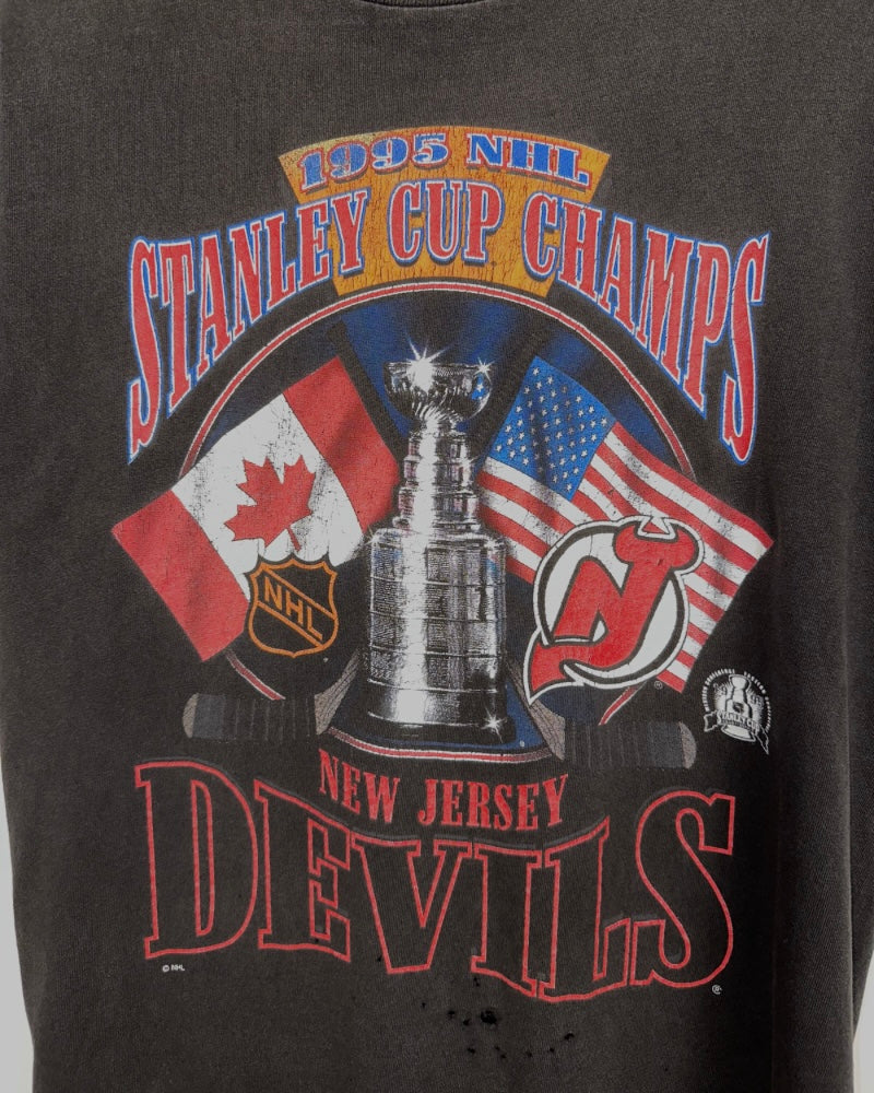 
                  
                    Vintage Starter '95 Stanley Cup Champions New Jersey Devils NHL T-Shirt - Size S
                  
                