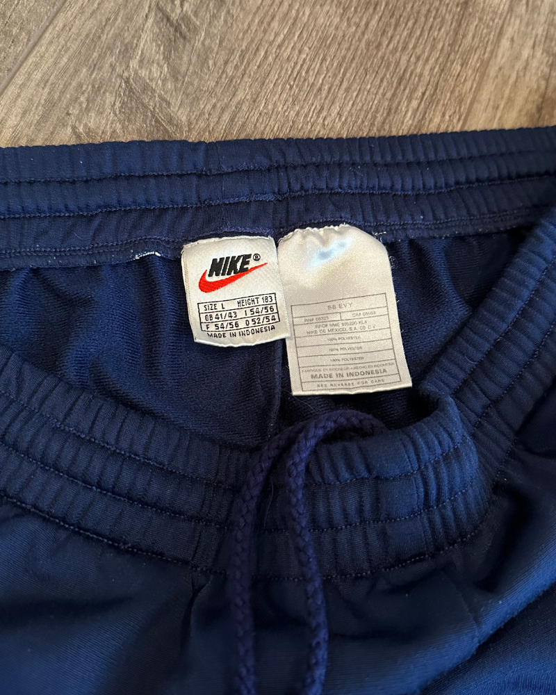 
                  
                    Vintage 90's Nike Track Pants - Size L
                  
                