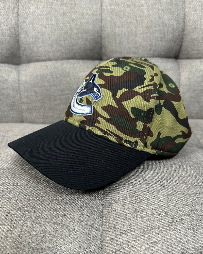 
                  
                    New - Vancouver Canucks NHL Camo Strap Back Cap Hat
                  
                