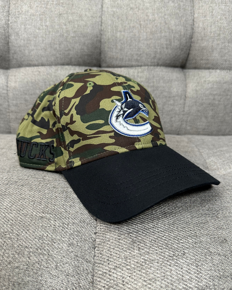 
                  
                    New - Vancouver Canucks NHL Camo Strap Back Cap Hat
                  
                